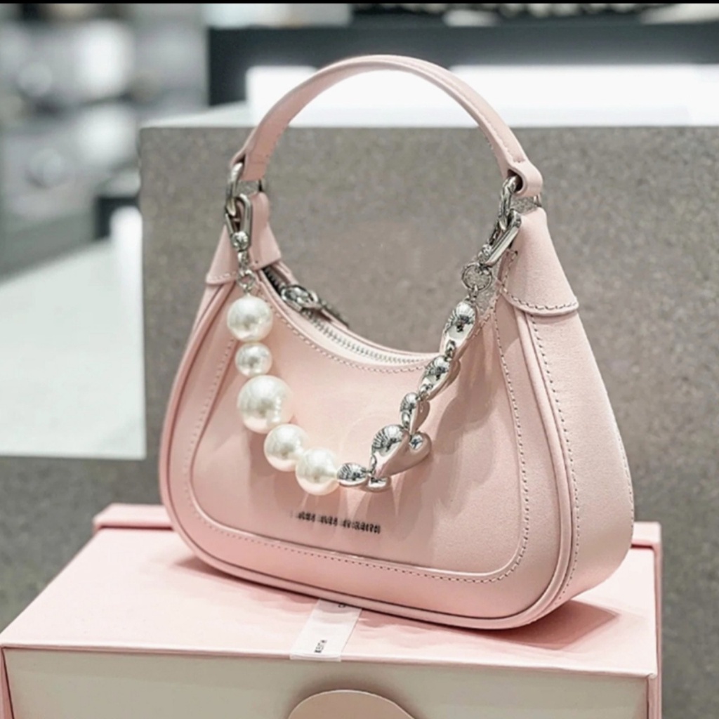 Túi cầm tay CnK màu hồng phối dây đeo hình trái tim và ngọc trai nhân tạo fullbox làm quà