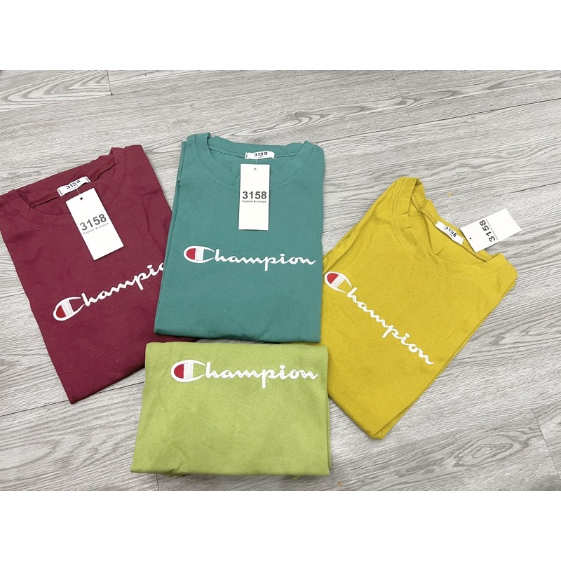 Áo phông tay lỡ chữ champi form rộng