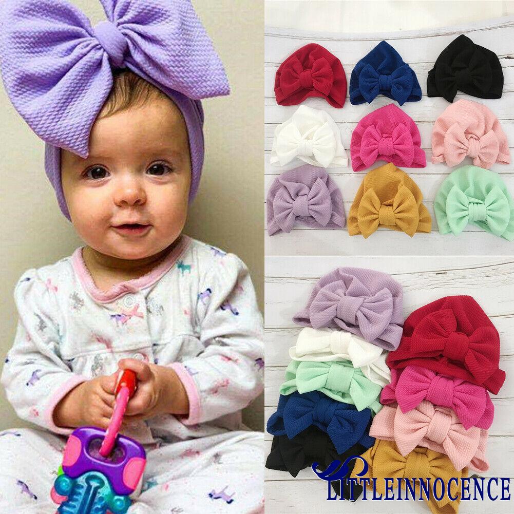 Mũ trùm đầu dính nơ nhiều màu dễ thương dành cho bé