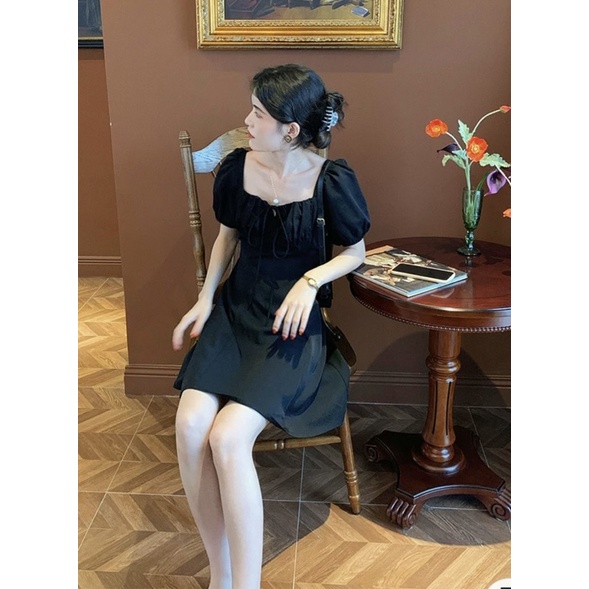 Váy rúm ngực nơ cúc bọc ống tay bồng chất vải mát nhẹ nhành cực xinh