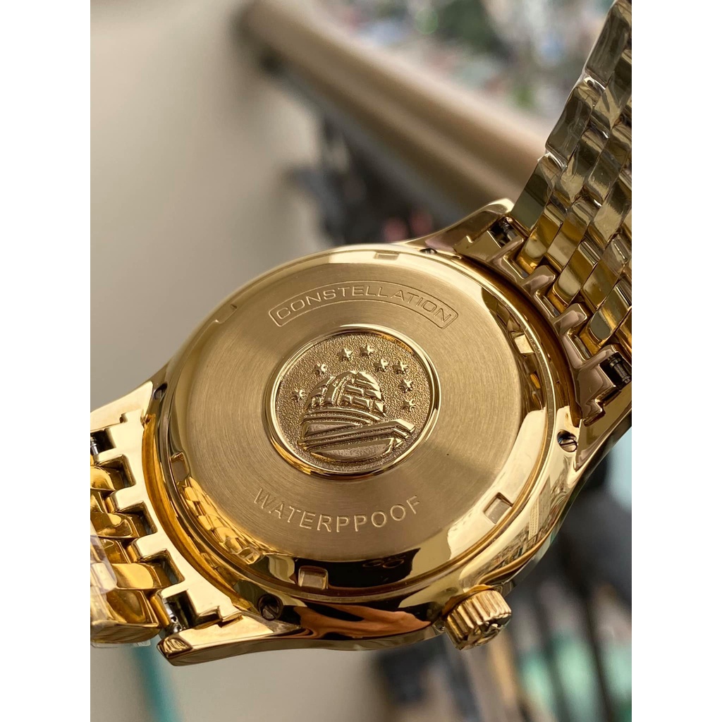 Đồng hồ Nam Omg Constellation bát quái máy nhật Myota vỏ vàng ta mặt trắng dòng cơ Automatic size 38mm-40mm dây kim loại