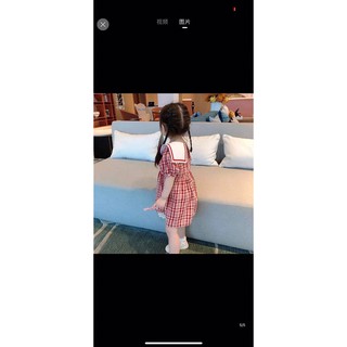 Váy kẻ đỏ nơ bé gái