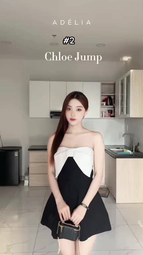 Áo liền quần Jumpsuit Adélia đen phối trắng kèm hoa trà | BigBuy360 - bigbuy360.vn