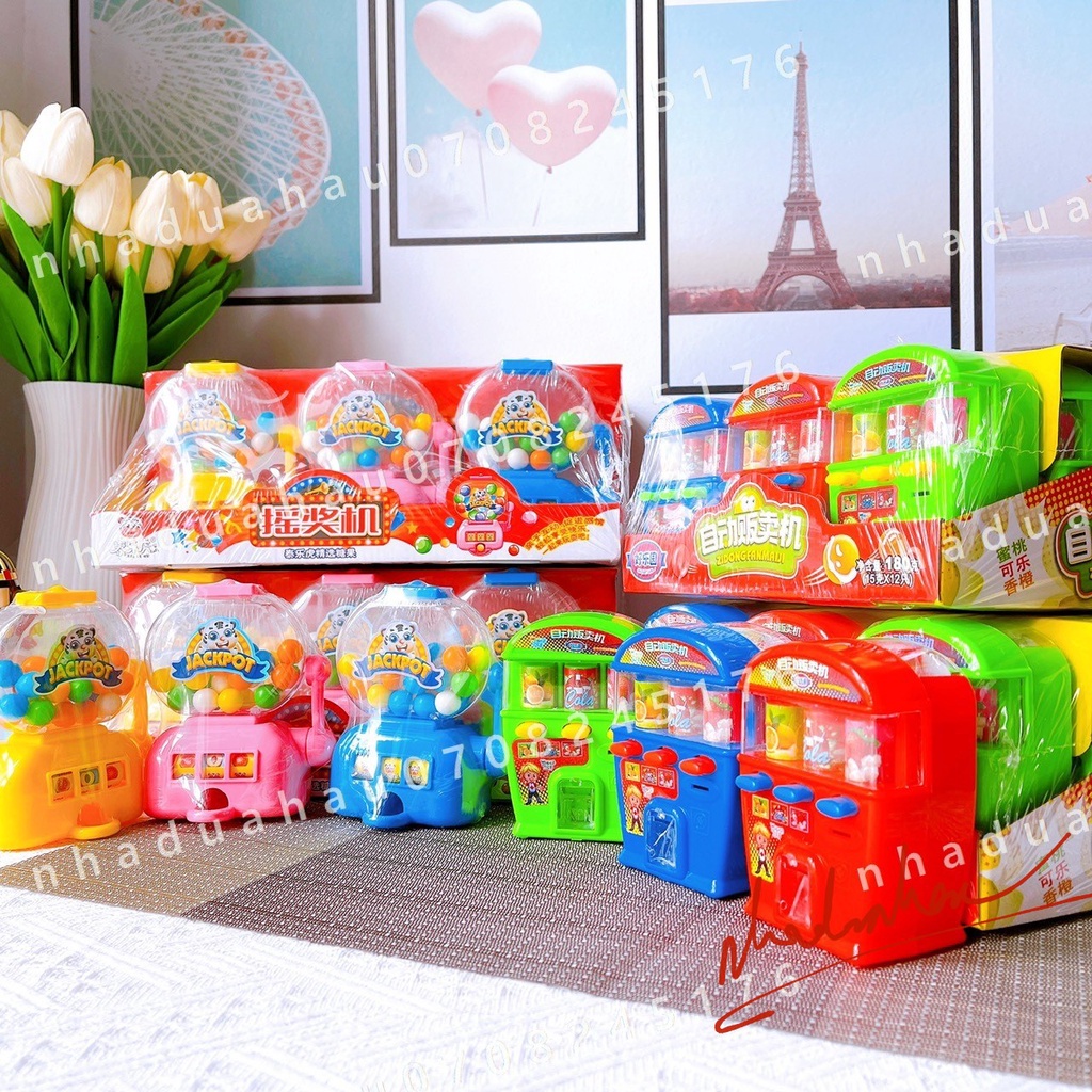 Máy bắn kẹo (có sẵn kẹo) hình máy bán hoa quả/ máy bán nước ngọt tự động Hongkong cái lớn 180gam