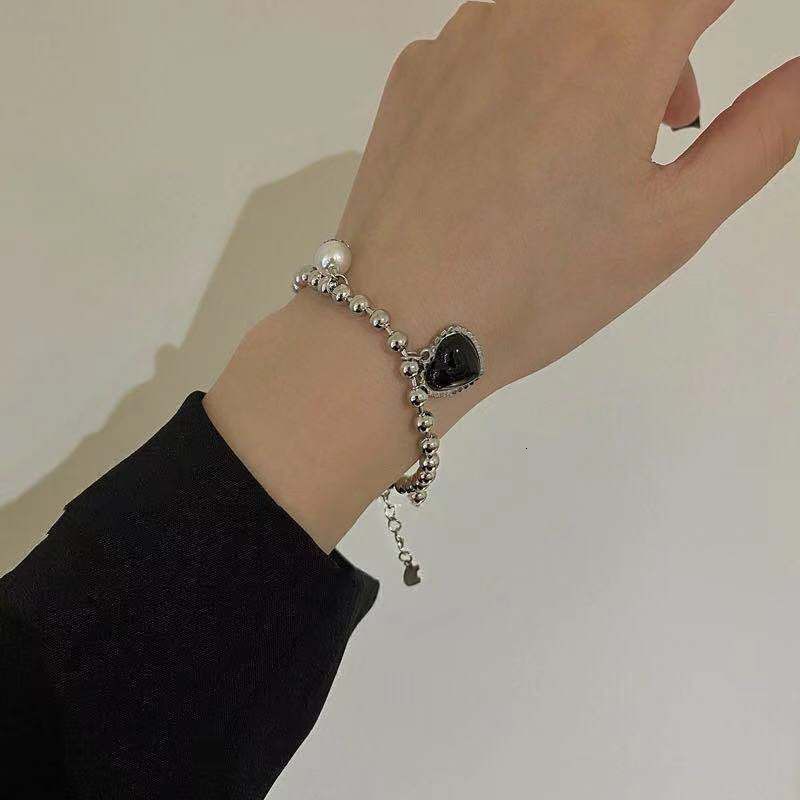 Vòng tay bằng thép titan màu đen đính ngọc trai nhân tạo phong cách cổ điển thời trang cho nữ