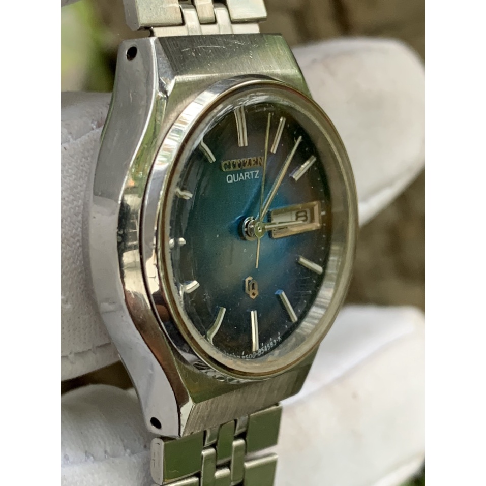 Đồng hồ nữ CITIZEN Pin  mặt màu xanh dương, có ô cửa lịch, dây kim loại  của Thụy