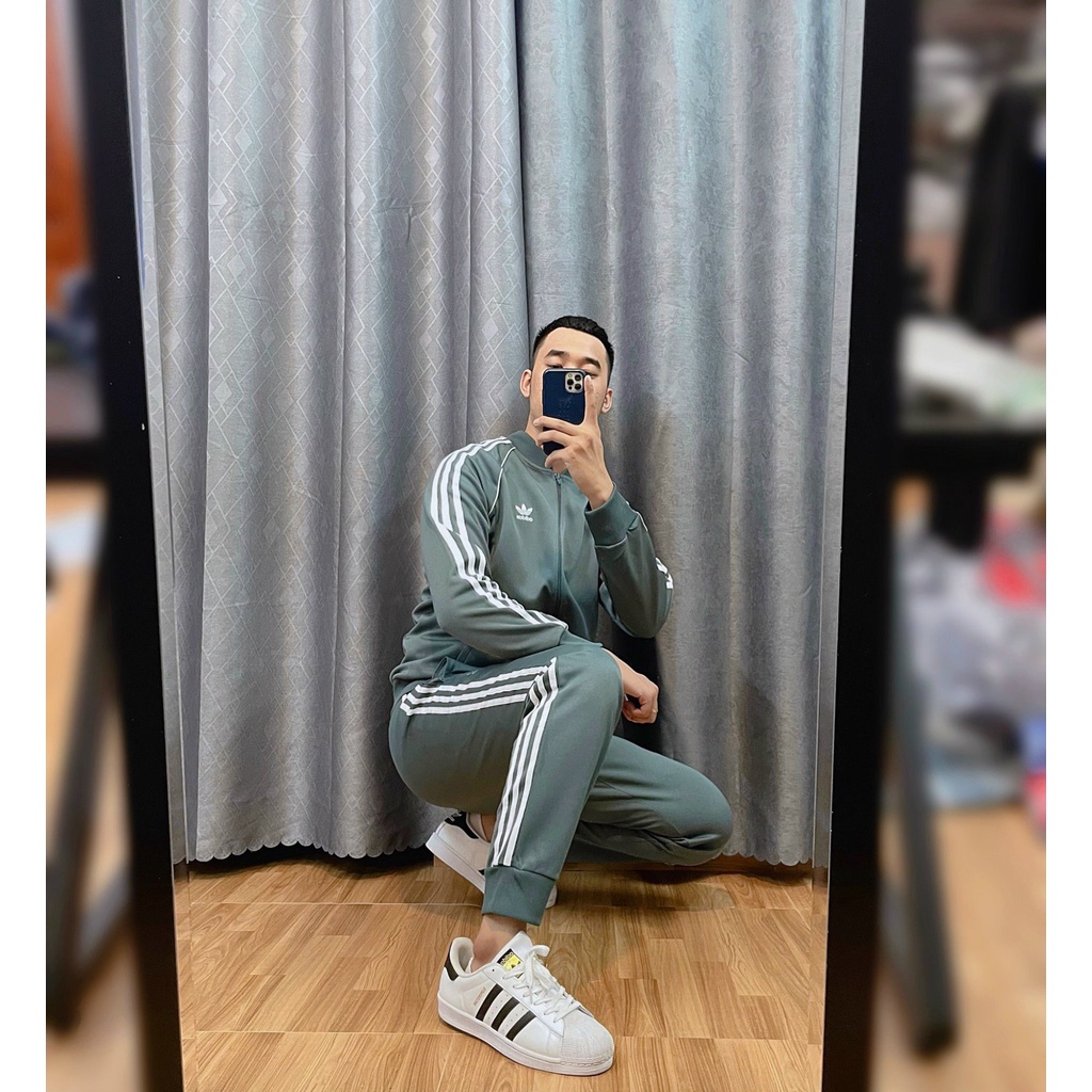 Bộ Quần Áo Thể Thao Unisex Nam Nữ Adidas SST Track Màu Xi Măng