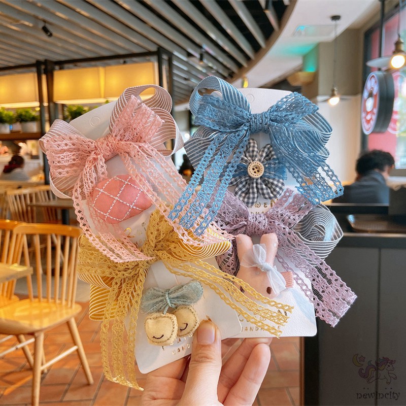 Bộ 2 kẹp tóc đính nơ ren và trang trí nhân vật hoạt hình xinh xắn đáng yêu cho bé gái