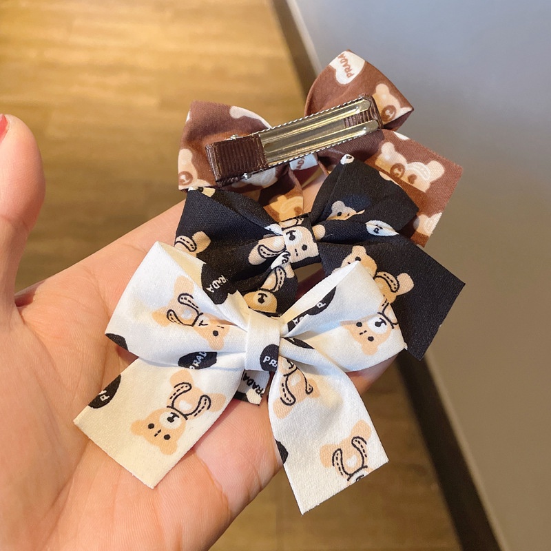 Kẹp tóc hình nơ màu đỏ sữa cà phê xinh xắn cho bé gái