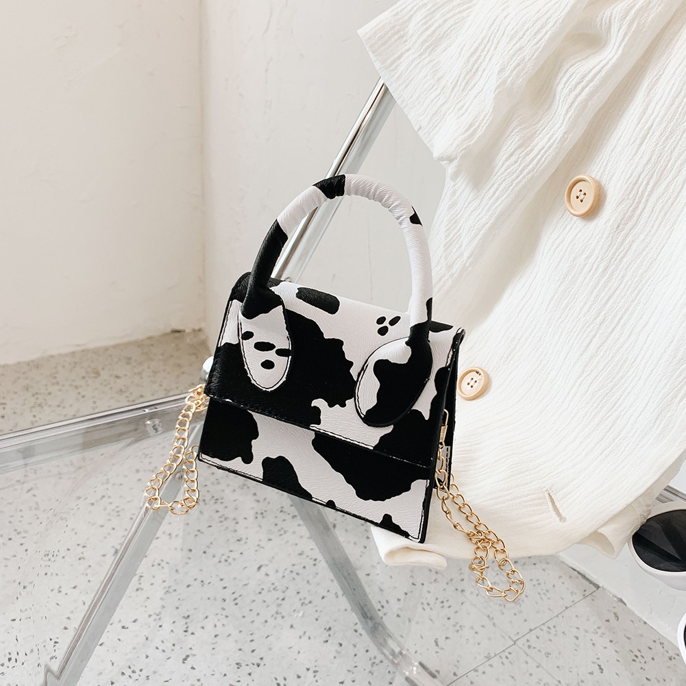 Túi đeo chéo da PU họa tiết bò sữa hợp thời trang cho nữ