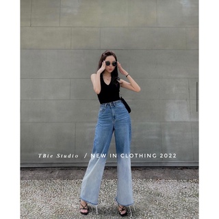 Quần jeans loang rách