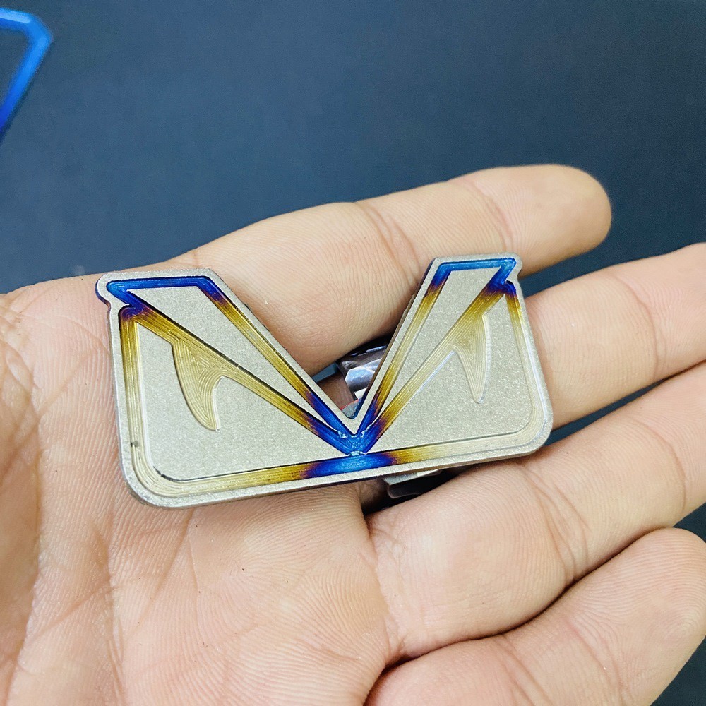 TEM trang trí xe máy HOẠT HÌNH MẮT CÚ chất liệu TITANNIUM