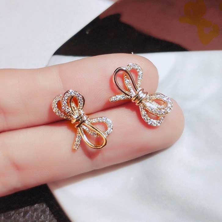 Khuyên tai JIUDUOLAN mạ bạc thiết kế nơ ruy băng đính đá nhân tạo màu vàng hồng thời trang dành cho nữ