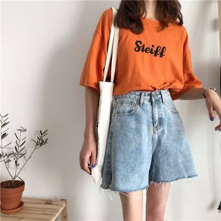 Quần short denim ống rộng tua lai