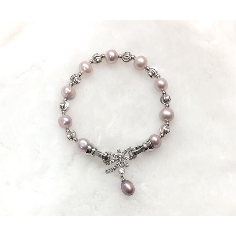 Vòng tay hạt màu hồng phấn khóa nơ