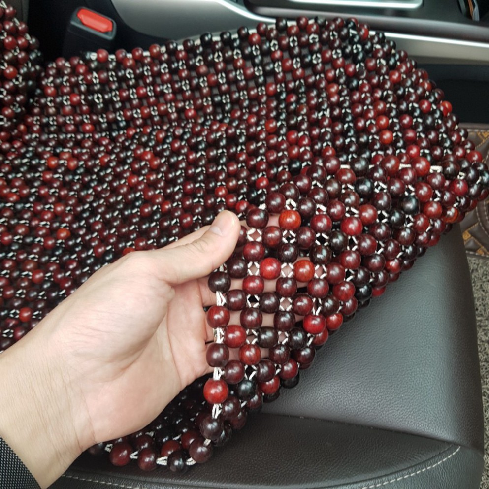 Sản Phẩm Đệm lót ghế ô tô hạt gỗ Cẩm Lai 100% tự nhiên tựa lưng massage trên ô tô .