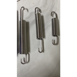 lò xo chống đứng inox