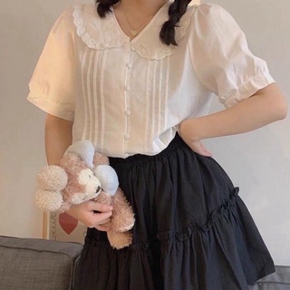 Áo sơ mi nữ trắng cộc tay bồng dáng babydoll. Áo sơ mi trắng cúc bọc cổ sen viền ren cộc tay.