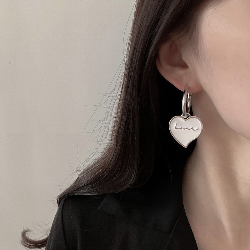 Bông tai dài hình nơ tua rua đơn giản