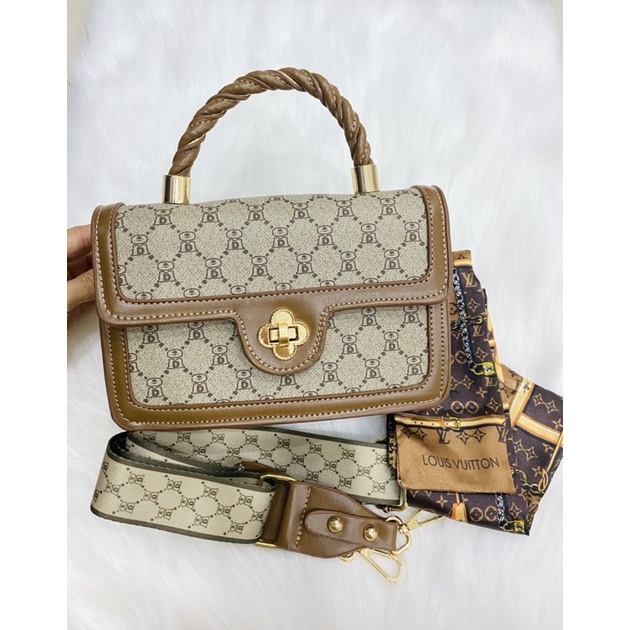 Túi xách khoá bông quai xoắn