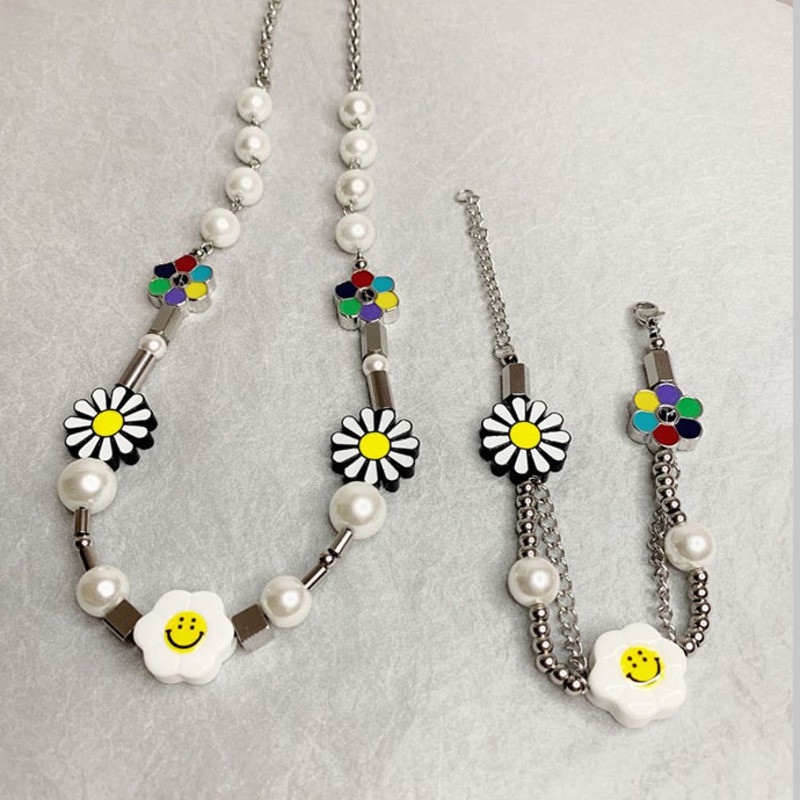 Dây chuyền/Vòng tay mặt hoa cúc và mặt cười làm từ thép titan cao cấp