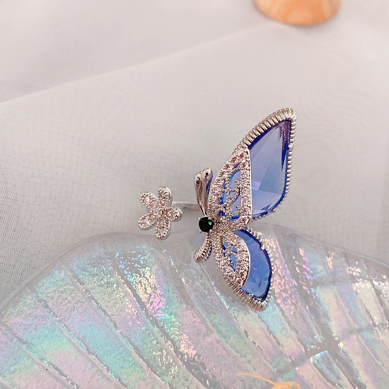 Nhẫn dạng hở mặt hình bông hoa và bươm bướm đính đá pha lê lớn điều chỉnh được mẫu 2020 thời trang cho nữ