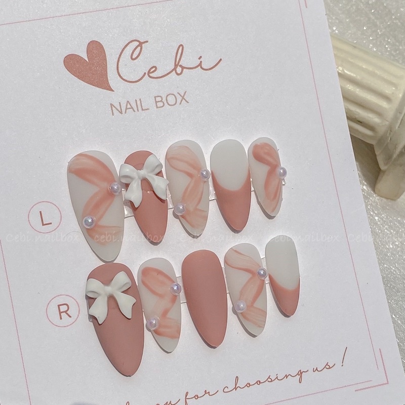 Móng úp thiết kế màu hồng c018 đính nơ cebi.nailbox