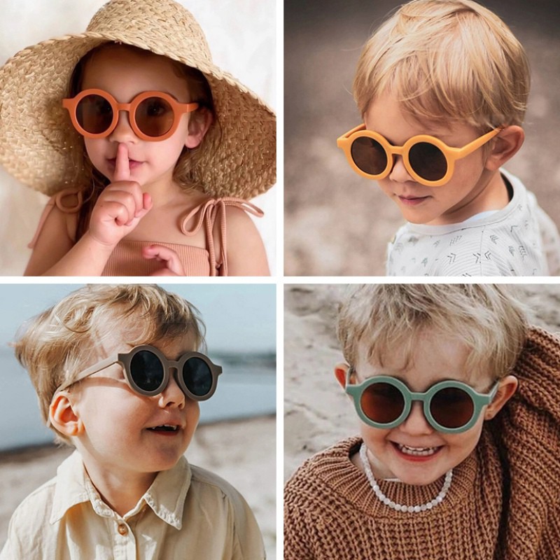 Kính mát gọng tròn chống tia cực tím màu trơn đáng yêu cho bé