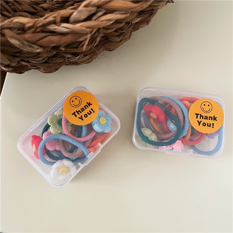 Hộp 7 chiếc cột tóc hoa nhựa nhiều màu cho bé