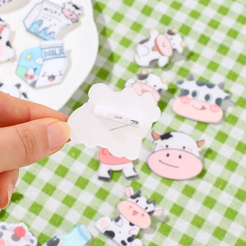 H06 - HUY HIỆU CÀI ÁO,BALO BÒ SỮA