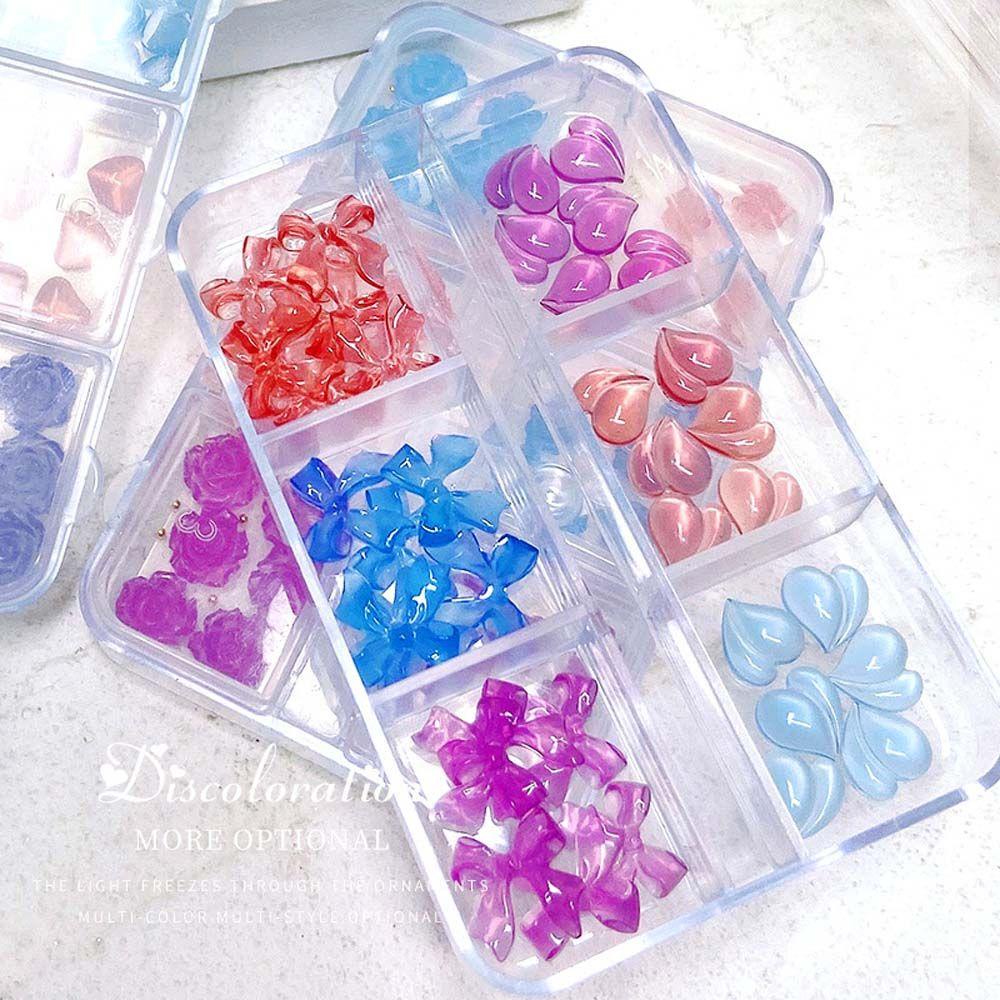 Hộp 6 Ngăn Đựng Phụ Kiện Trang Trí Móng Nghệ Thuật Hình Nơ Hoa Đào Bằng Nhựa Resin Màu Laser