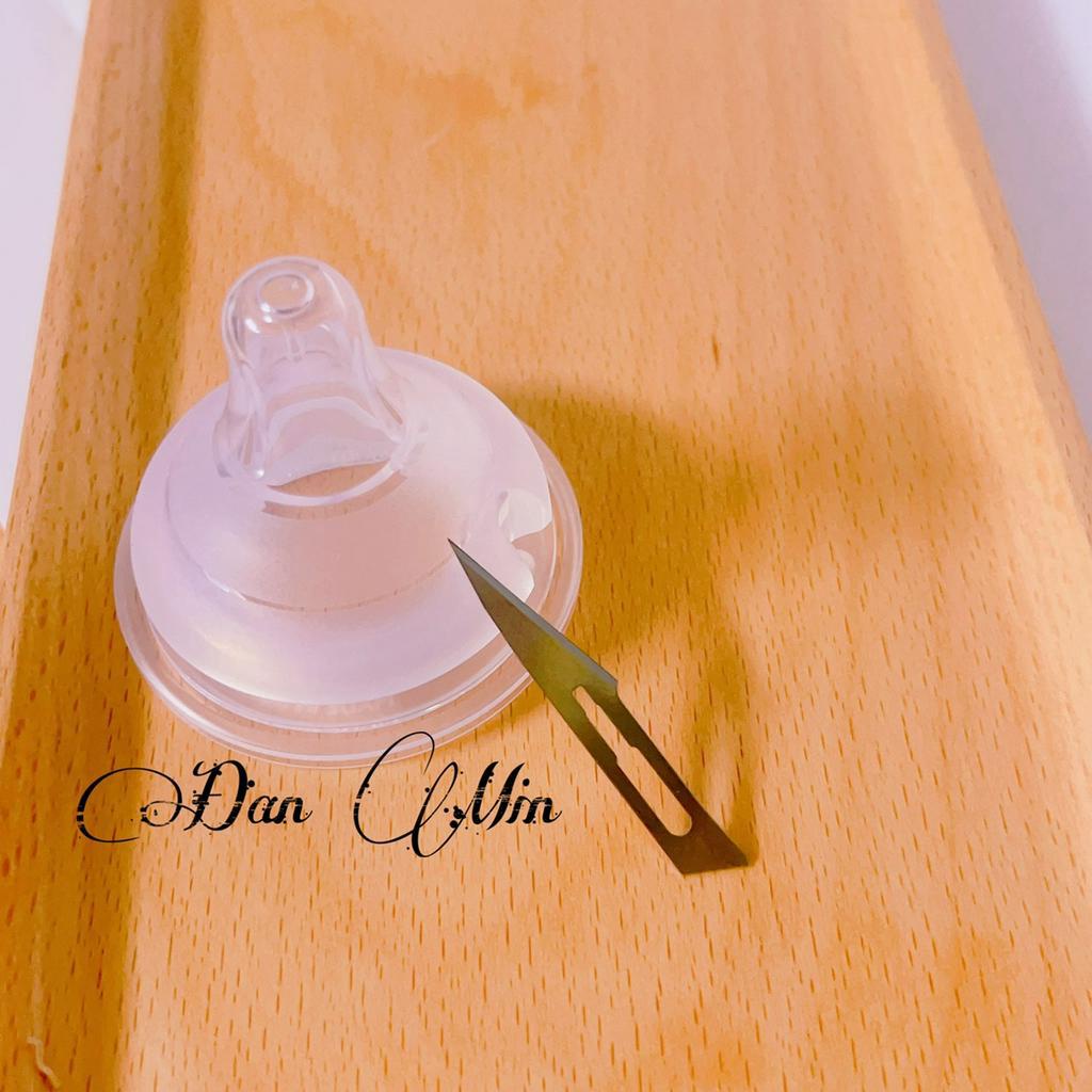 Đục núm ti bình sữa, cây đục lỗ núm ti moyuum hegen pigeon avent.....