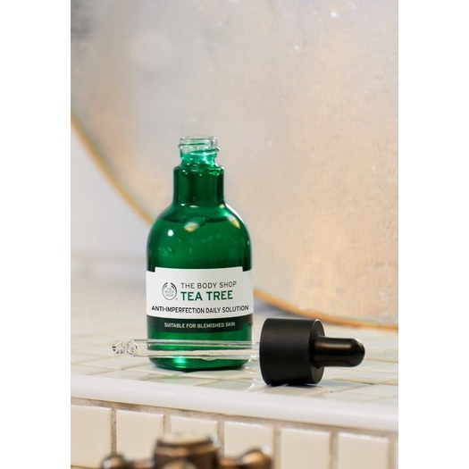 Tinh chất dưỡng da dành cho da mụn The Body Shop tea tree anti-imperfection daily solution 50ml