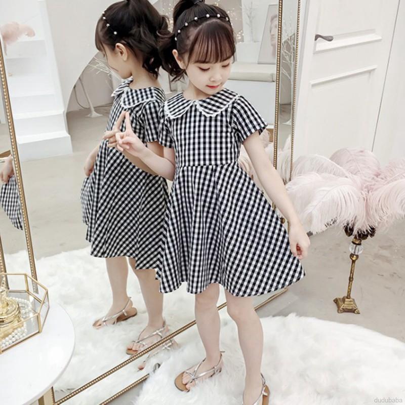 Đầm caro đính nơ sau lưng hở lưng tay ngắn thời trang đáng yêu cho bé gái 3-12t