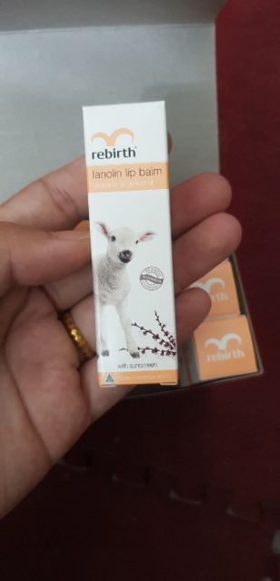 Son Dưỡng Môi Nhau Thai Cừu Và Vitamin E Rebirth Lanolin Lip Balm Vitamin E & Apricot Oil (sách tay)