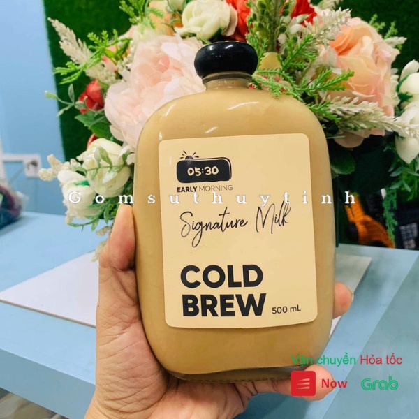 Chai thủy tinh/ Bình thủy tinh dẹt tròn nắp nhựa có dung tích là 500ml