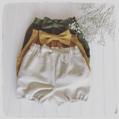 Quần Đùi Short Cho Bé Gái Có Nơ Siêu Dễ Thương Chất Đũi Xước Mát Nhẹ Size 10-21kg