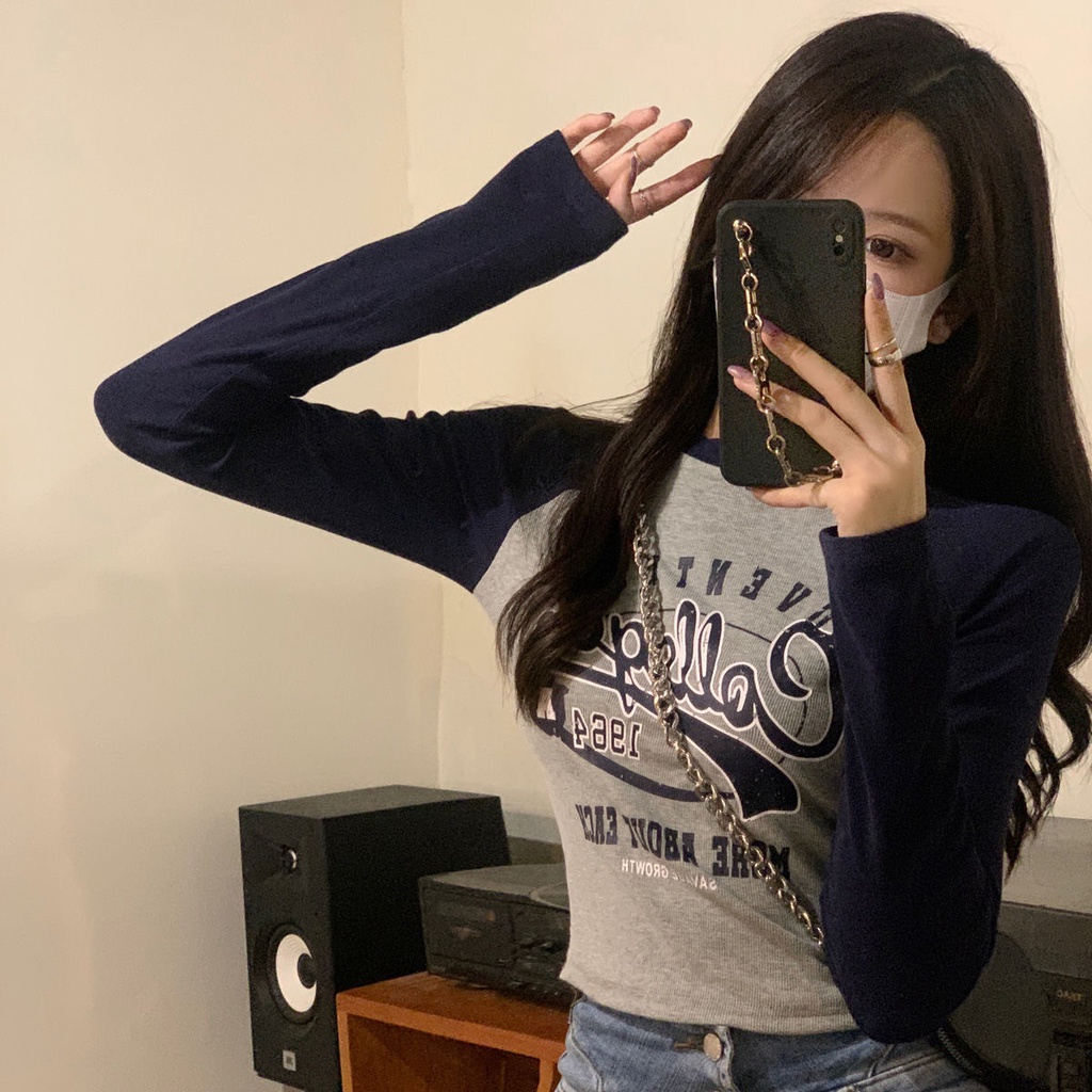 Áo thun tay dài in họa tiết màu sắc tương phản đầy phong cách cho nữ