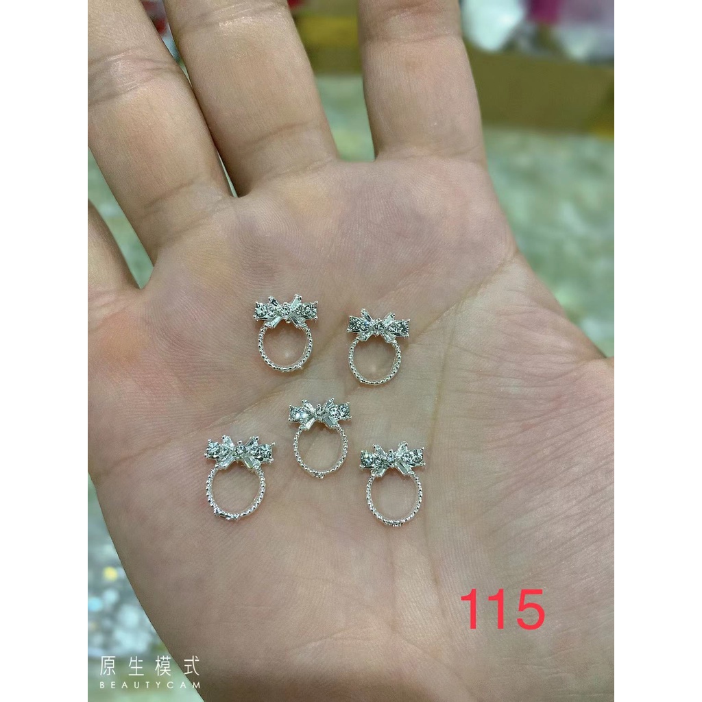Charm nơ tròn bạc nail mã115