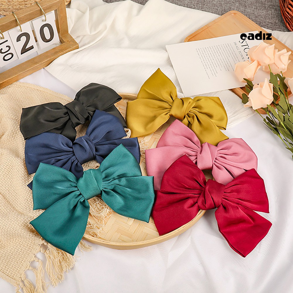 Kẹp tóc nơ màu trơn xinh xắn đáng yêu