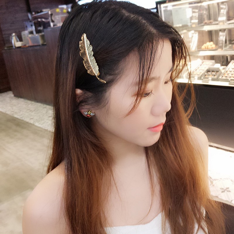 Kẹp tóc hình lông vũ xinh xắn retro cho nữ
