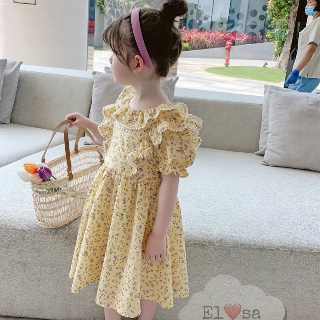 Váy hoa nền vàng bèo phối cho bé