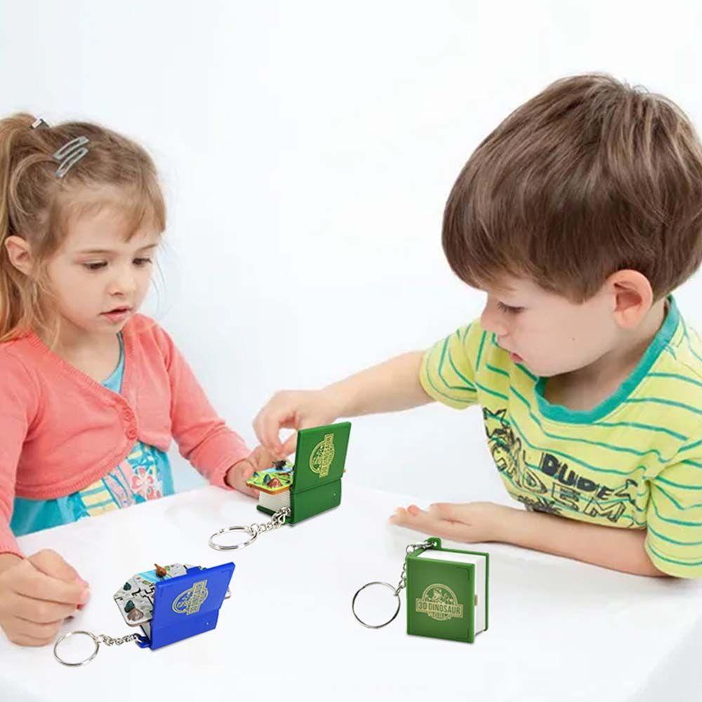 Móc Khóa Hình Quyển Sách / Phi Hành Gia / Khủng Long Mini Ngộ Nghĩnh