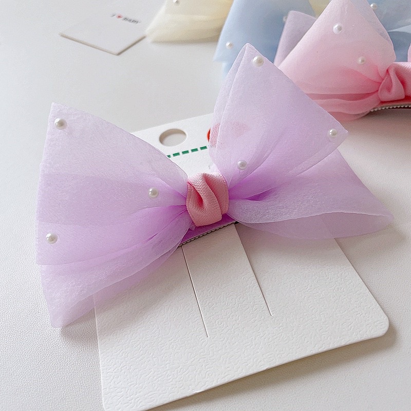 Nơ voan đính hạt dáng 3D màu pastel xinh xinh cho bé