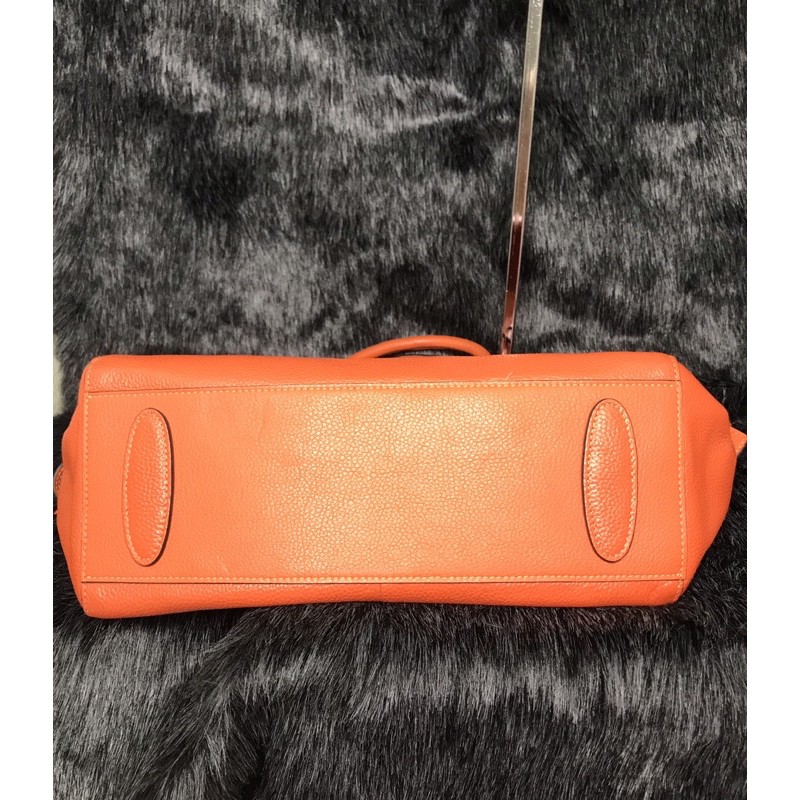 👜  Túi cầm tay, đeo chéo da thật màu cam hiệu Tucano