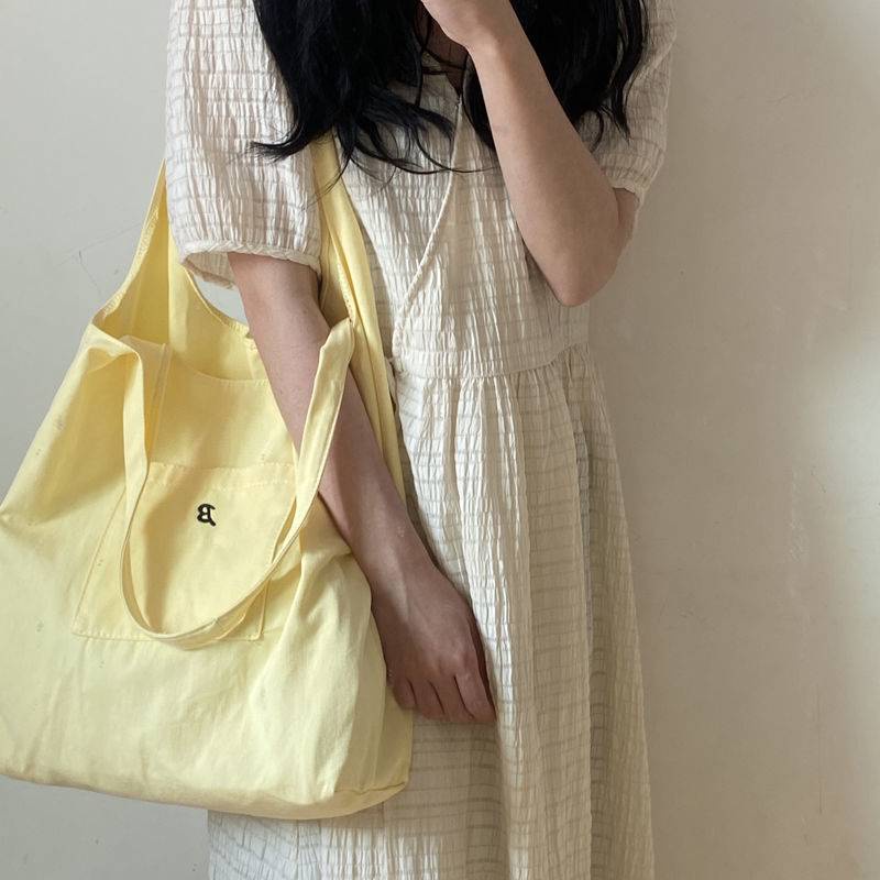 Túi đeo vai vải canvas màu vàng nhạt phong cách hè dành cho nữ