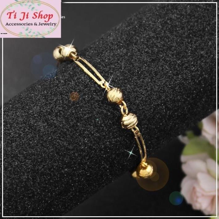 Lắc tay nữ inox mạ vàng chạm máy cách điệu thời trang