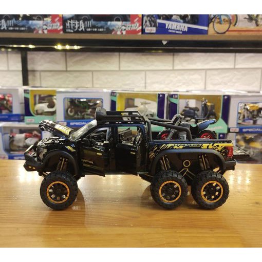 MÔ HÌNH XE Ô TÔ FORD F150 Beast Raptor 6x6 Offroad đúc Kim Loại - tỷ lệ 1:28