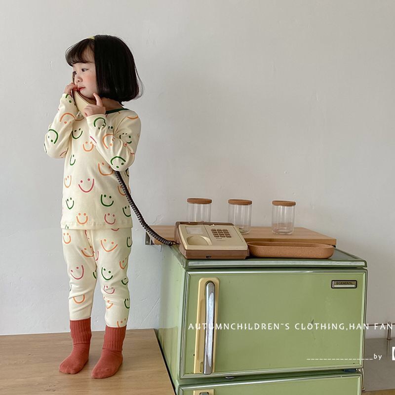 Bộ áo thun tay dài và quần dài in hình mặt cười cho trẻ sơ sinh