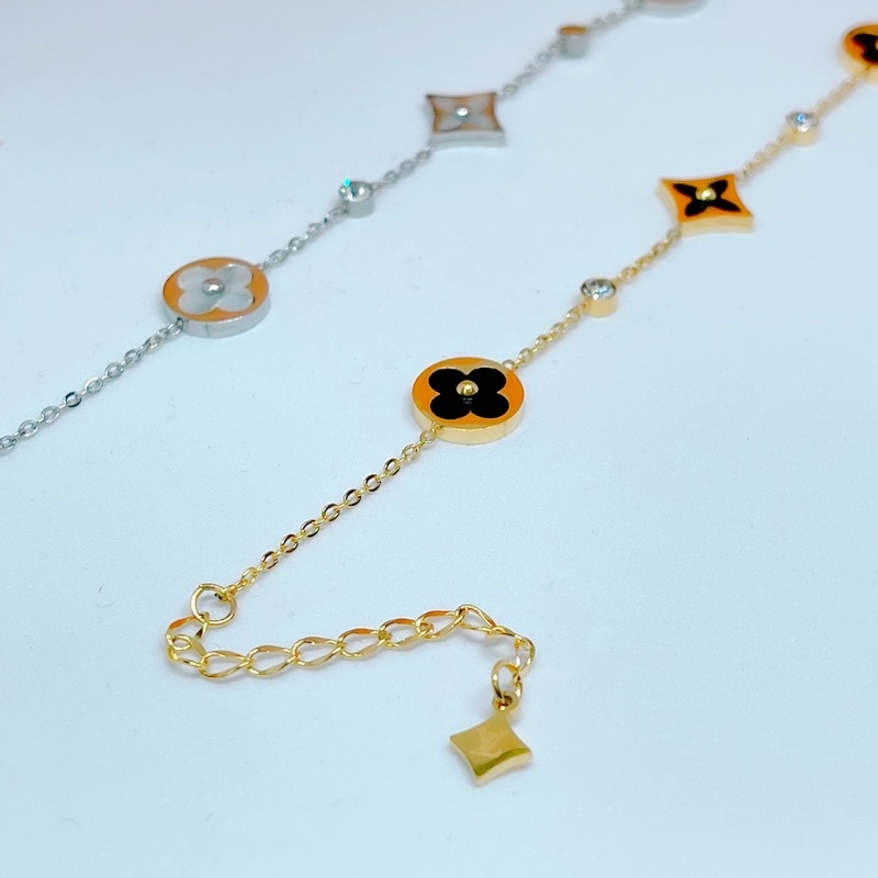 Lắc tay titan V trắng - vàng ko đen